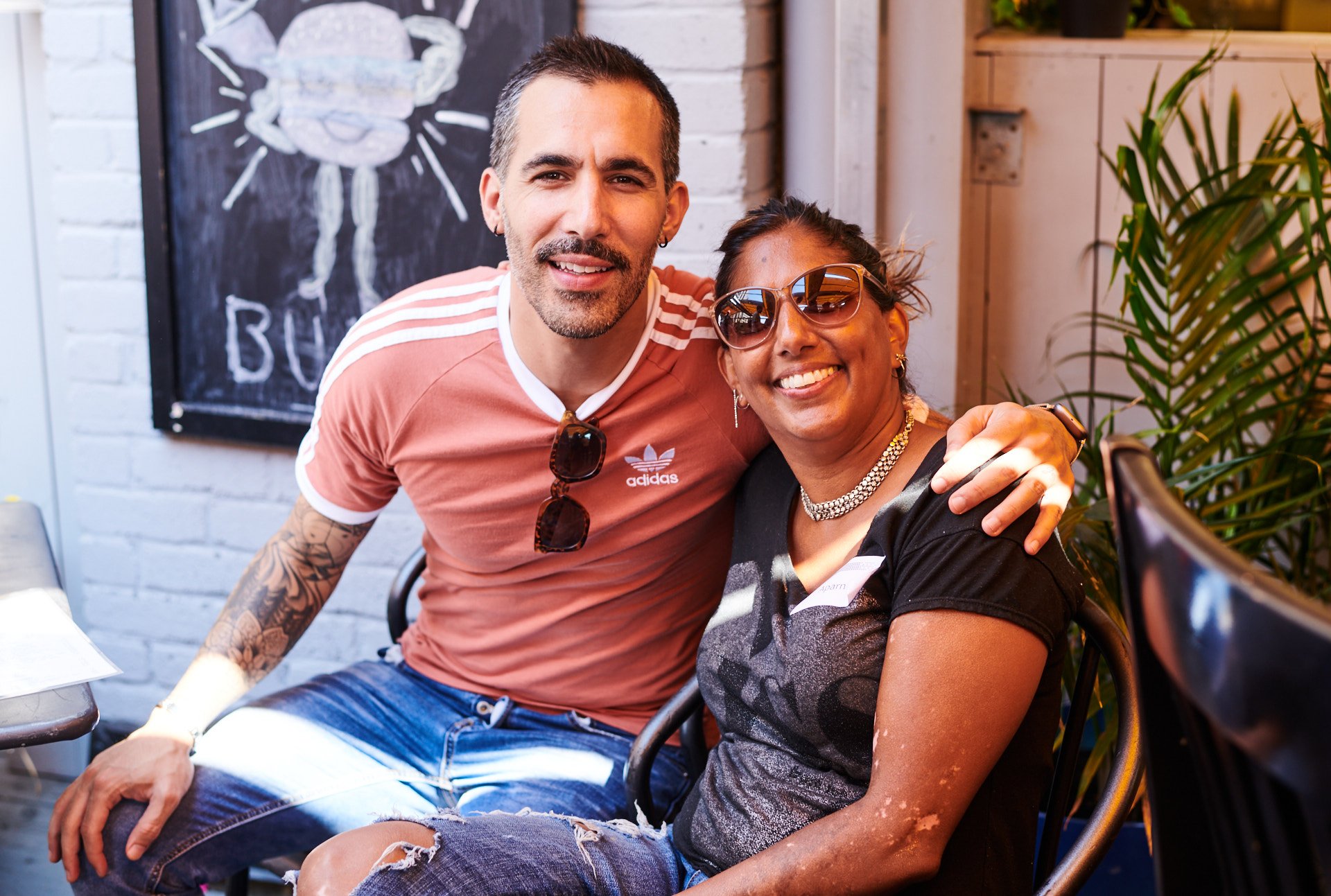 LyricFind employees smiling and embracing